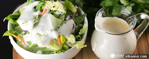 buttermilk ranch dressing.jpg A beautifully presented bowl of homemade buttermilk ranch dressing with fresh vegetables for dipping