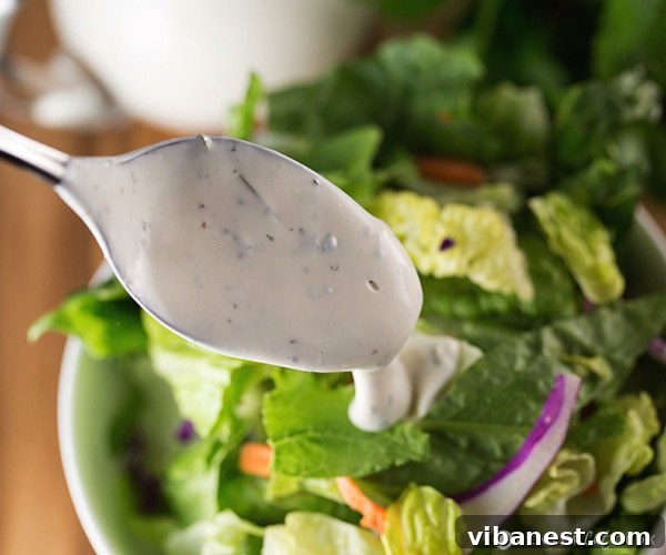buttermilk ranch dressing 6.jpg Adding buttermilk to the ranch dressing base, illustrating the mixing process for perfect consistency