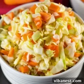 kfc coleslaw copycat recipe with fresh shredded cabbage, carrots and creamy dressing.