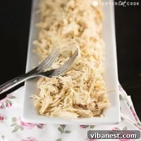Ultimate Chicken Alfredo Stuffed Shells 2 plate of easy slow cooker shredded chicken with two forks