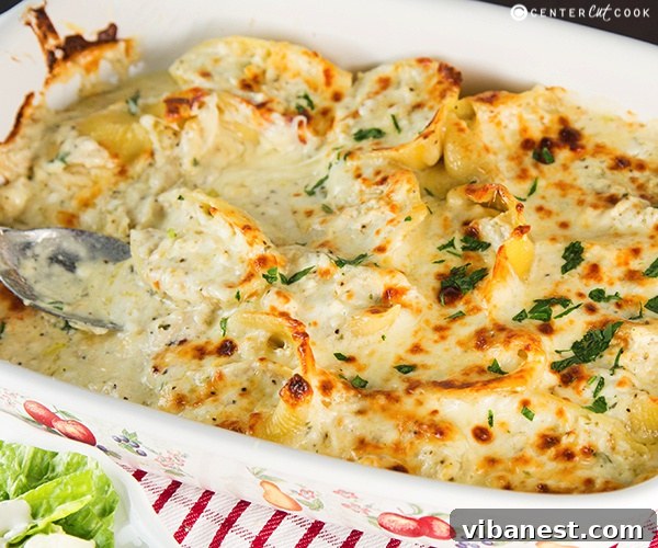 Cheesy Chicken Alfredo Stuffed Shells Shredded chicken in a bowl, ready for recipe
