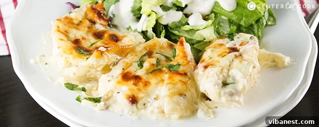 Cheesy Chicken Alfredo Stuffed Shells Cheesy chicken alfredo stuffed shells baked in casserole dish
