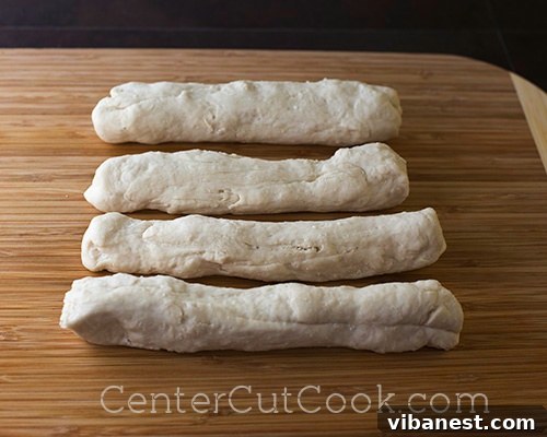 Pretzel Dough Ropes.jpg Dough ropes ready to be cut into pretzel bites for baking, ensuring uniform size.