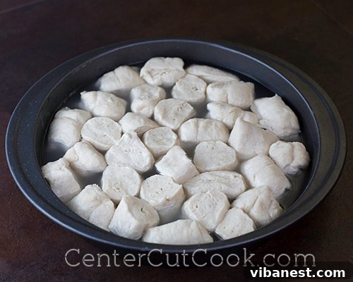Baking Soda Bath.jpg Pretzel bites soaking in a baking soda water bath, a critical step for authentic flavor and crust development.