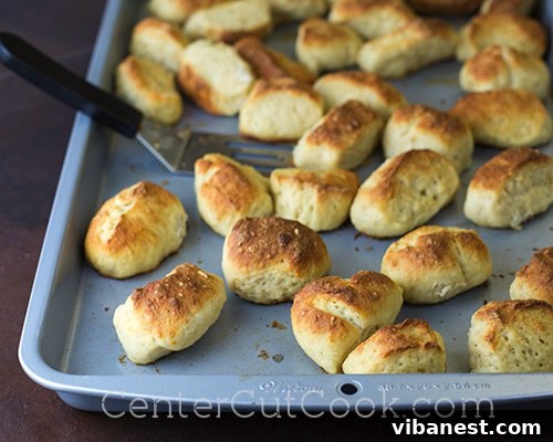 Baked Pretzel Bites.jpg Freshly baked cinnamon sugar pretzel bites, beautifully golden brown and emanating a sweet aroma, ready for their final coating.