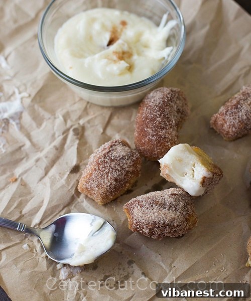 Cream Cheese Glaze.jpg Homemade cream cheese glaze, luxuriously creamy and perfectly prepared, ready to serve as the ideal dip for cinnamon sugar pretzel bites.