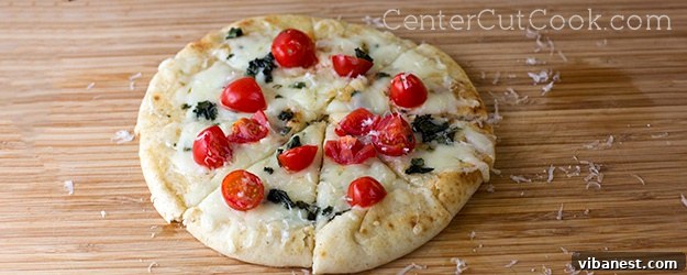 Delicious Caprese Flatbreads ready to be served, showcasing vibrant tomatoes, fresh basil, and melted mozzarella