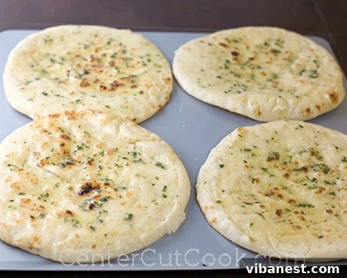 Buttery Garlic Flatbread Foundation Spreading garlic butter onto the flatbread base