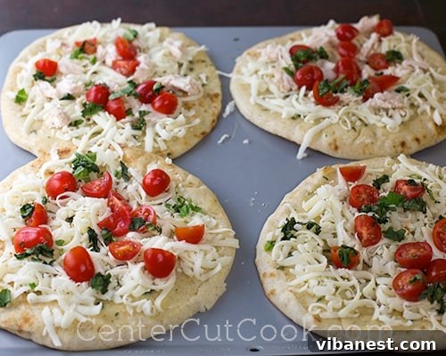 Caprese Toppings: Tomato, Basil, Chicken Topping flatbreads with fresh tomatoes, basil, and optional chicken